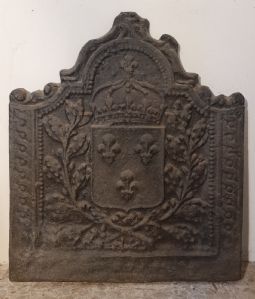 Cast iron fireplace plate decorated with coat of arms and lilies of Florence